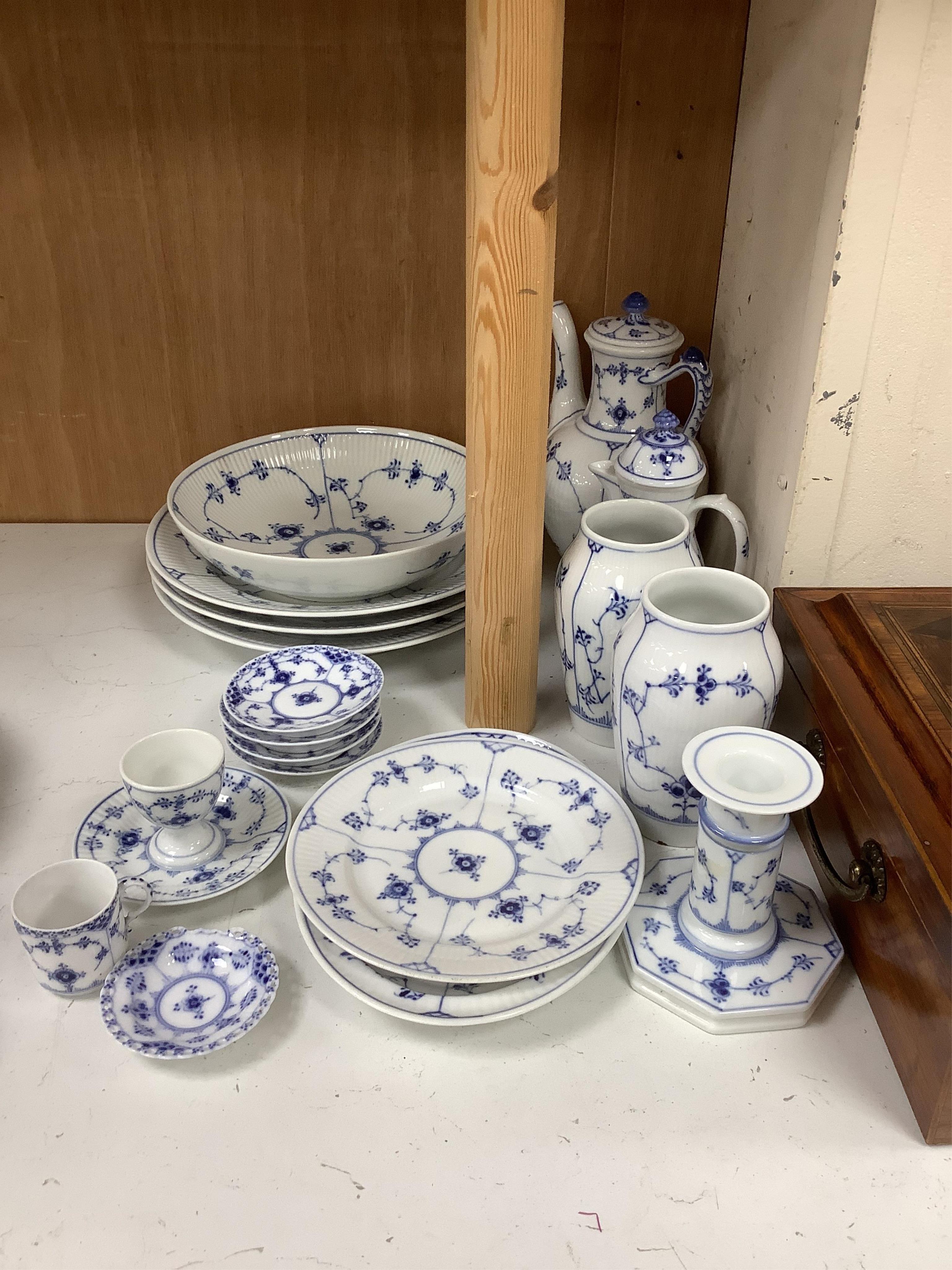 A collection of Royal Copenhagen and Bing & Grondahl onion pattern blue and white tableware